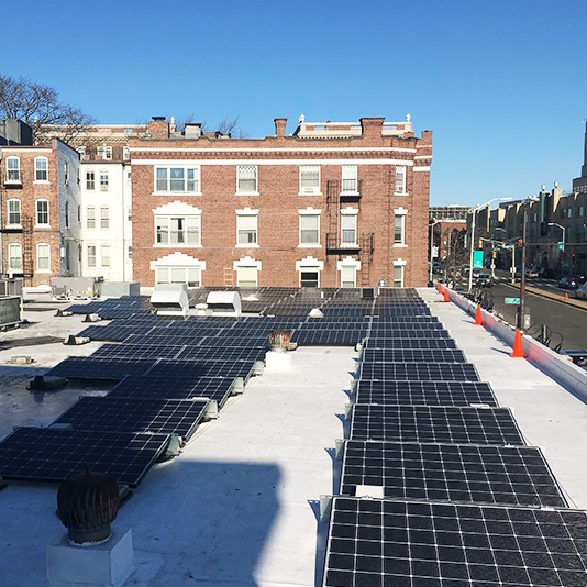 A picture of a roof mount array installed in Cambridge, MA - Mass Renewables Inc. 
